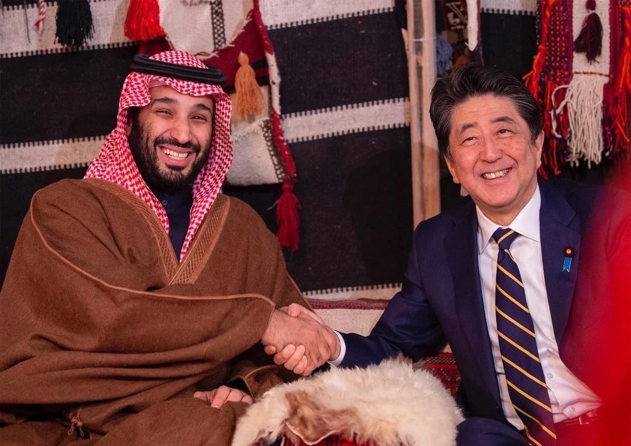 Saudi Crown Prince Mohammed bin Salman and Japanese Prime Minister Shinzo Abe shake hands during their meeting in AlUla.