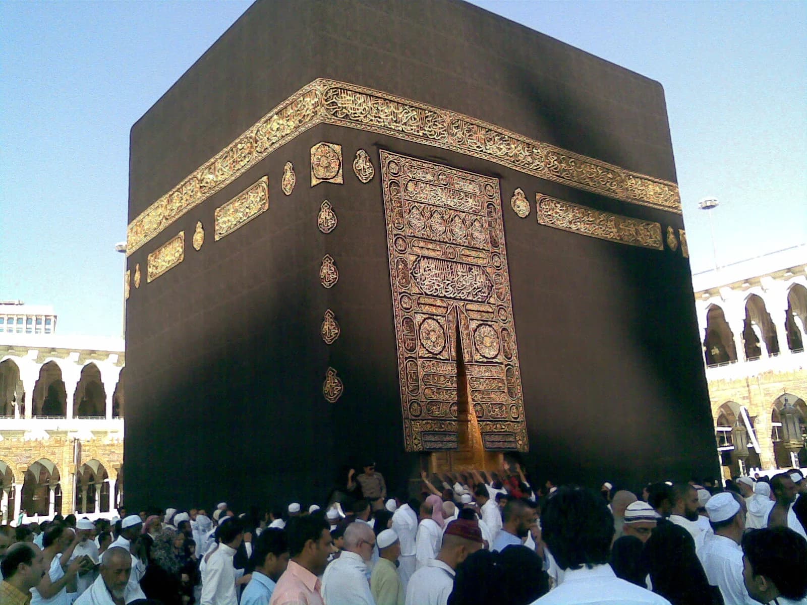 Kaaba Kiswah and doorway with worshippers — archival photograph